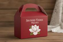 Load image into Gallery viewer, red gable box with SOUTHERN FIXINGS PRALINES in white with a magnolia flower on the front